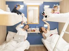 Family enjoying one of our 4 berth inside cabins with bunk beds